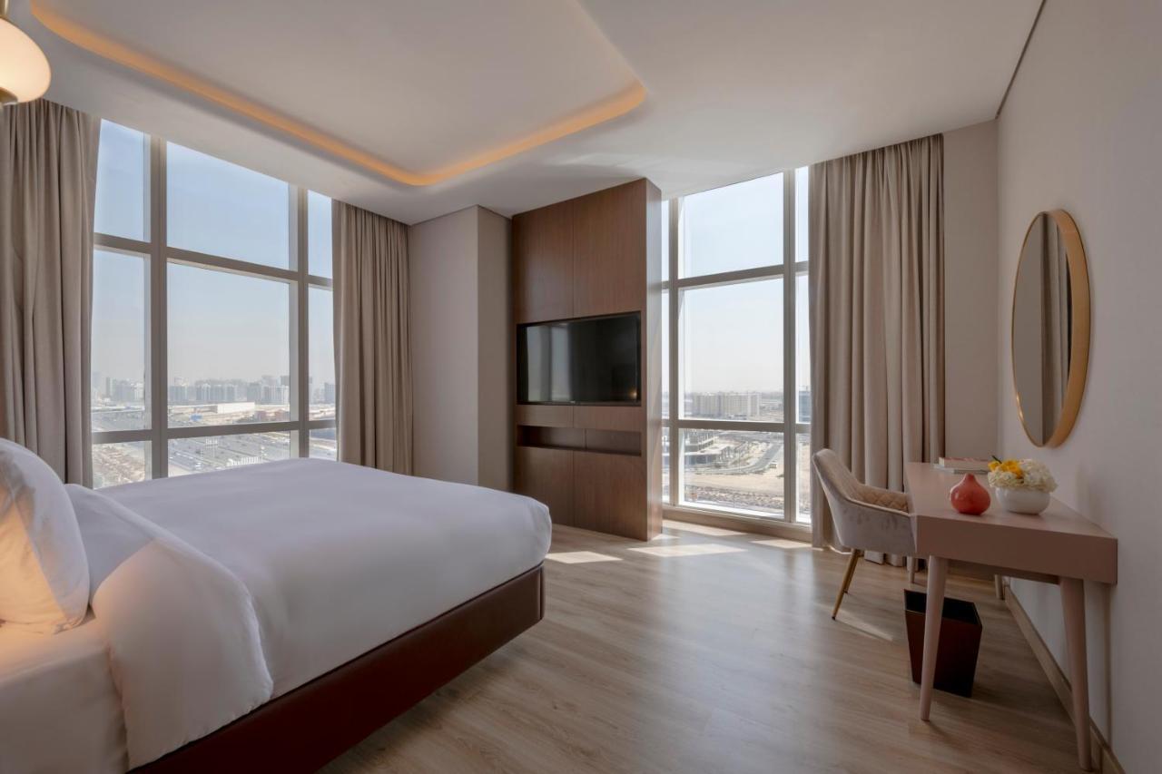 Movenpick Jumeirah Village Triangle Dubai Ngoại thất bức ảnh A bedroom at the hotel