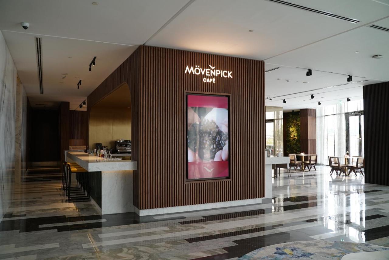 Movenpick Jumeirah Village Triangle Dubai Ngoại thất bức ảnh Mövenpick Café in the lobby of the Kempinski Hotel, Amman, Jordan
