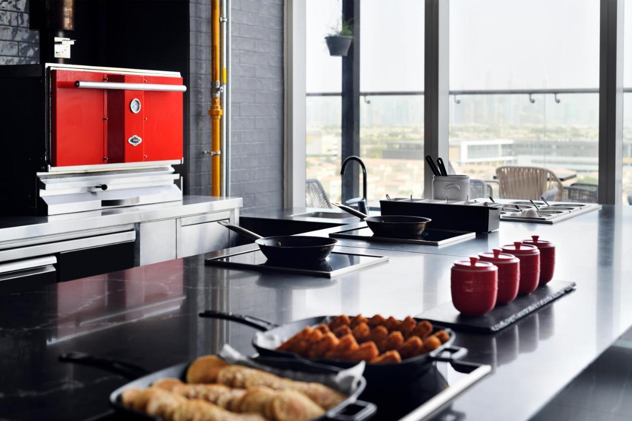 Movenpick Jumeirah Village Triangle Dubai Ngoại thất bức ảnh A commercial kitchen